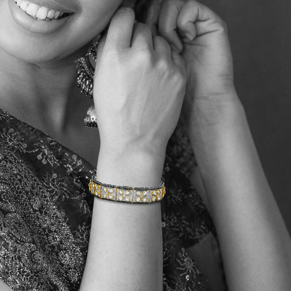 Tennis Bracelet with Floral Polkis and Black Diamond Border