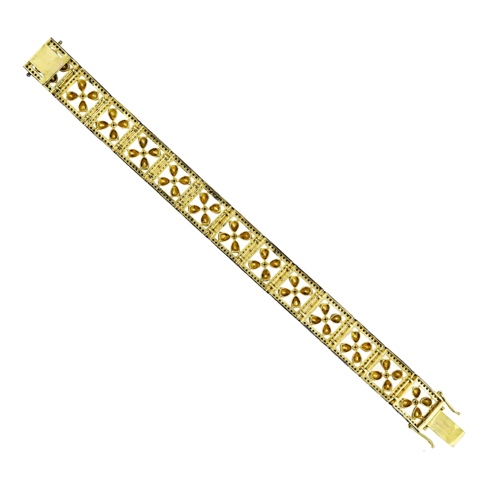 Tennis Bracelet with Floral Polkis and Black Diamond Border